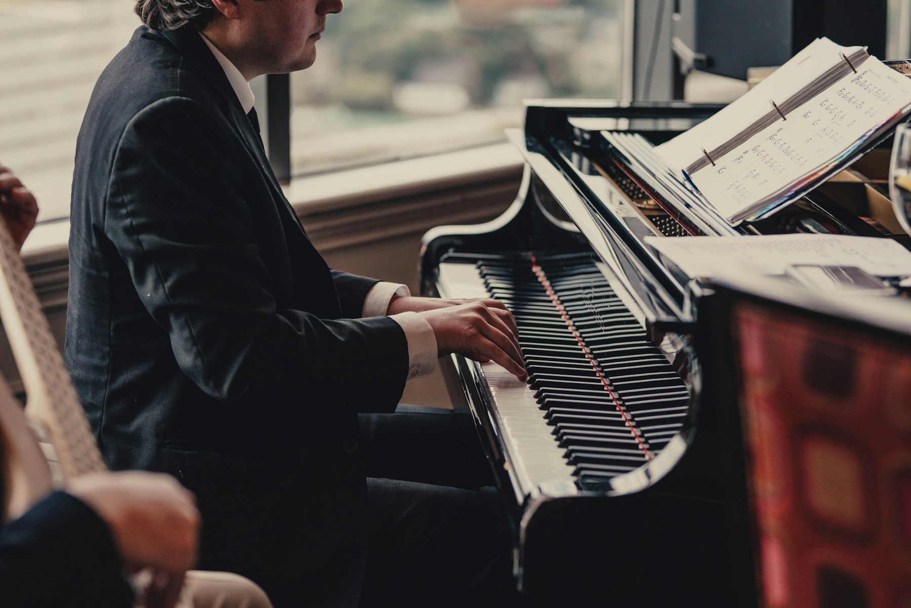 A pianist absorbed in rehearsal