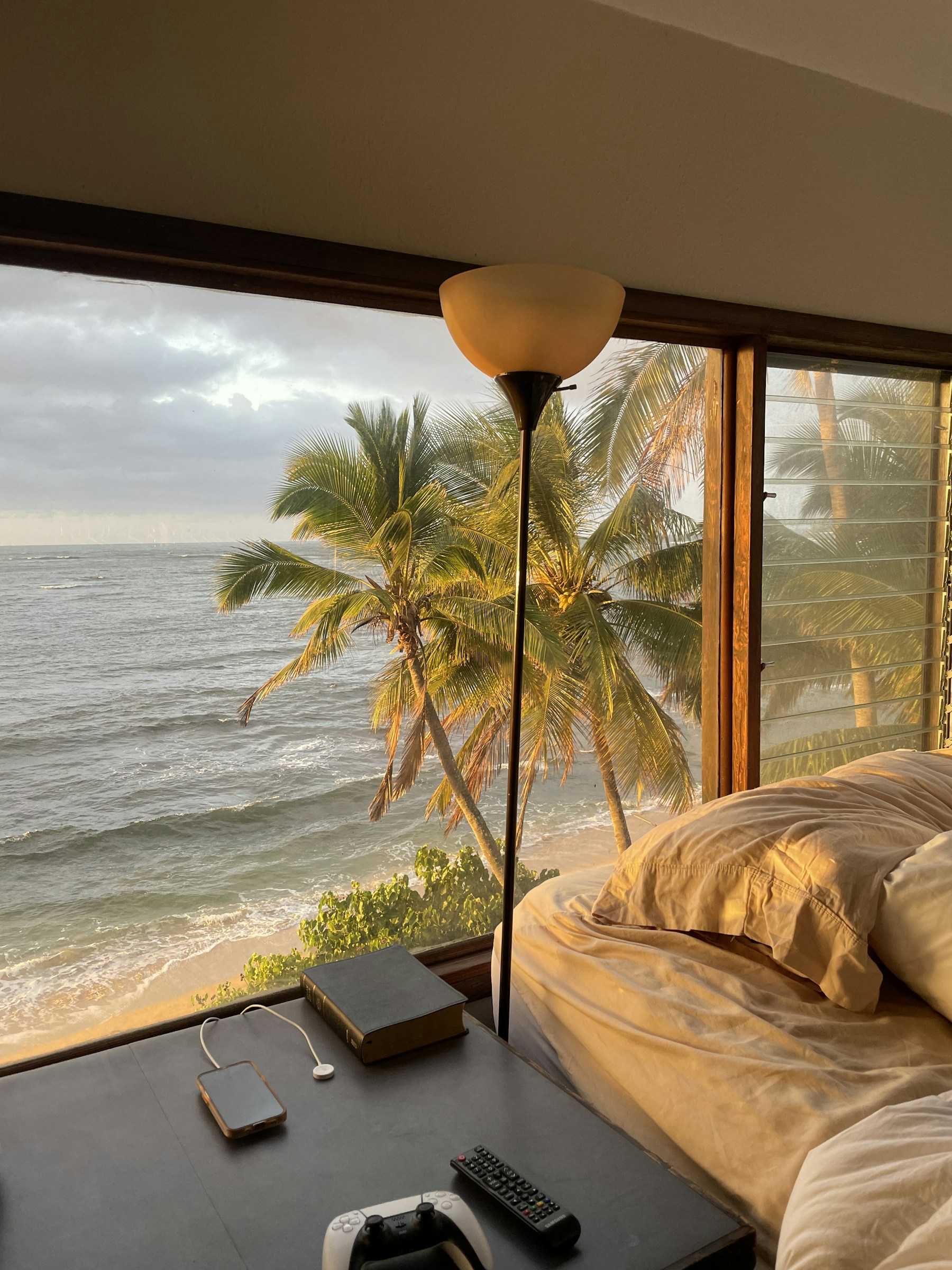 Bedroom with open windows overlooking the ocean